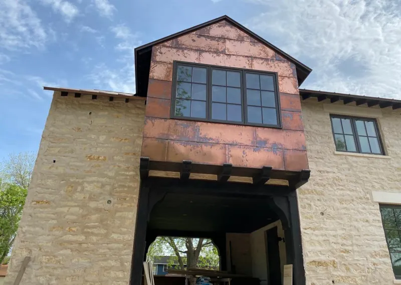 Copper metal panel facade on a stone building for Metal Roof Coating in Baltimore Highlands